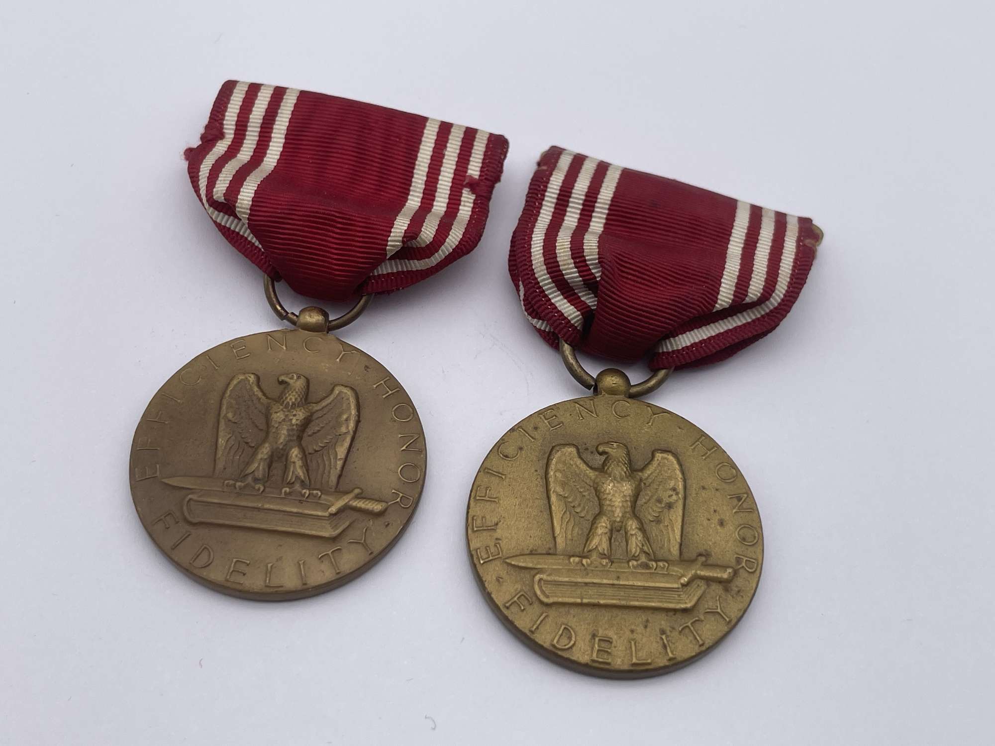 Pair, Original World War Two Era American Good Conduct Medal, Named to M E Lloyd