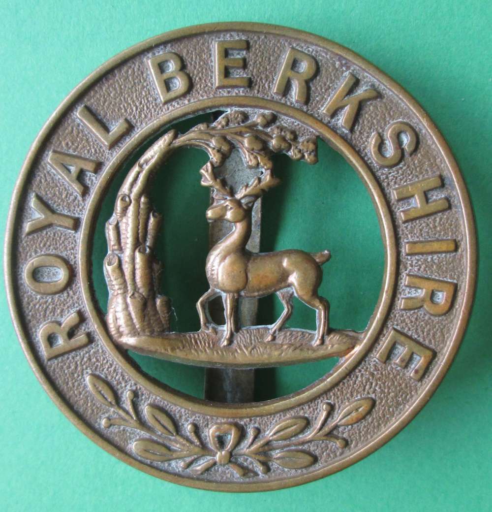 A ROYAL BERKSHIRE HELMET BADGE WITH SLIDER