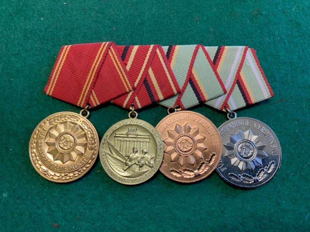 EAST GERMAN MEDAL GROUP in display case