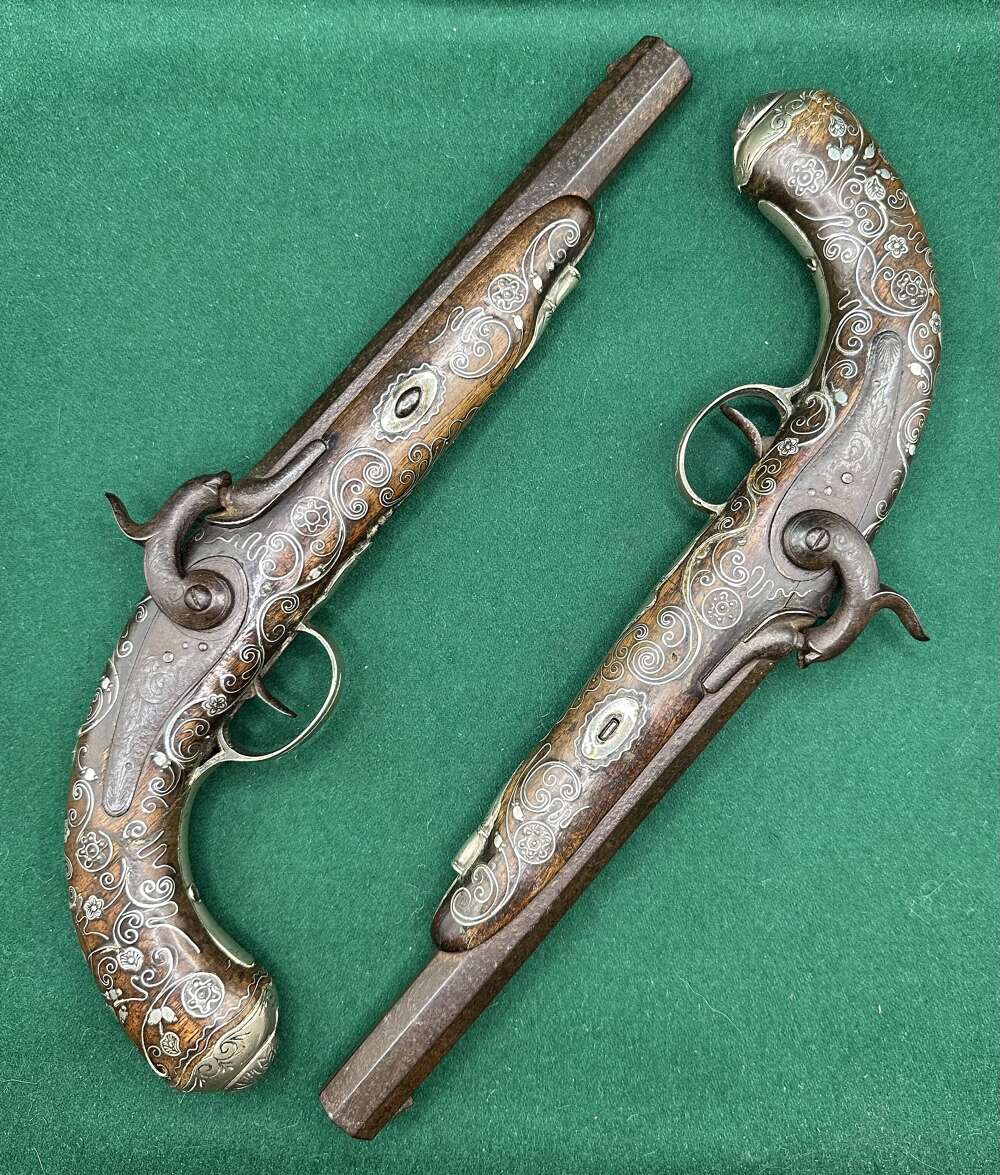 Pair Of Silver Inlaid Pistols